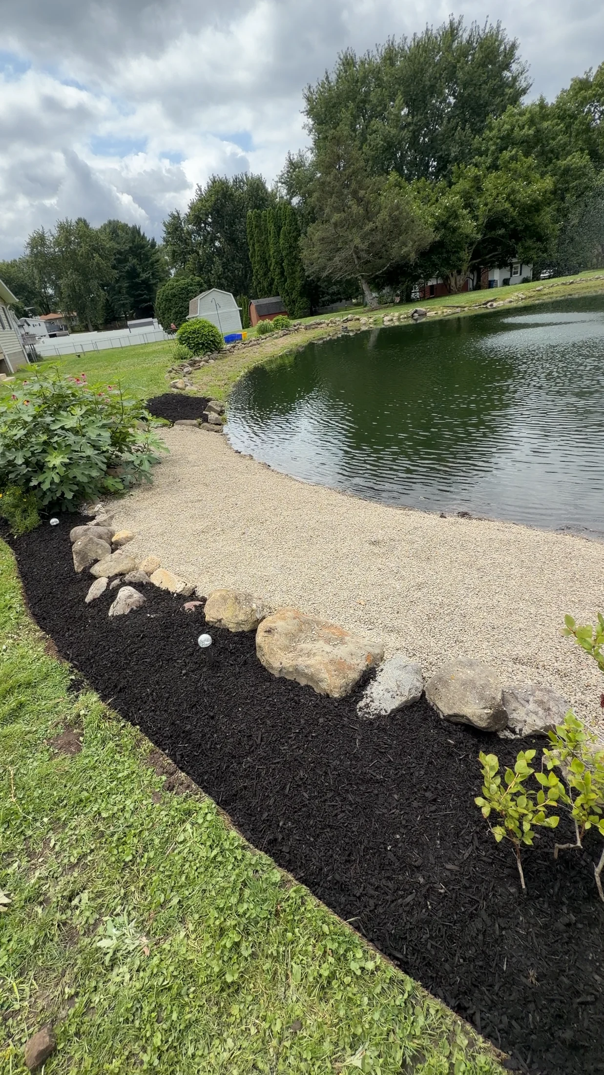 Pond border — refreshed gravel and mulch