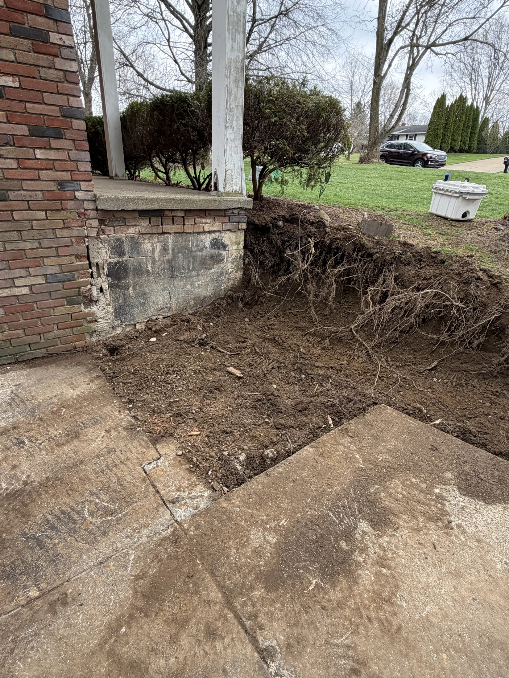 Porch entry during excavation and preparation before the new stone steps